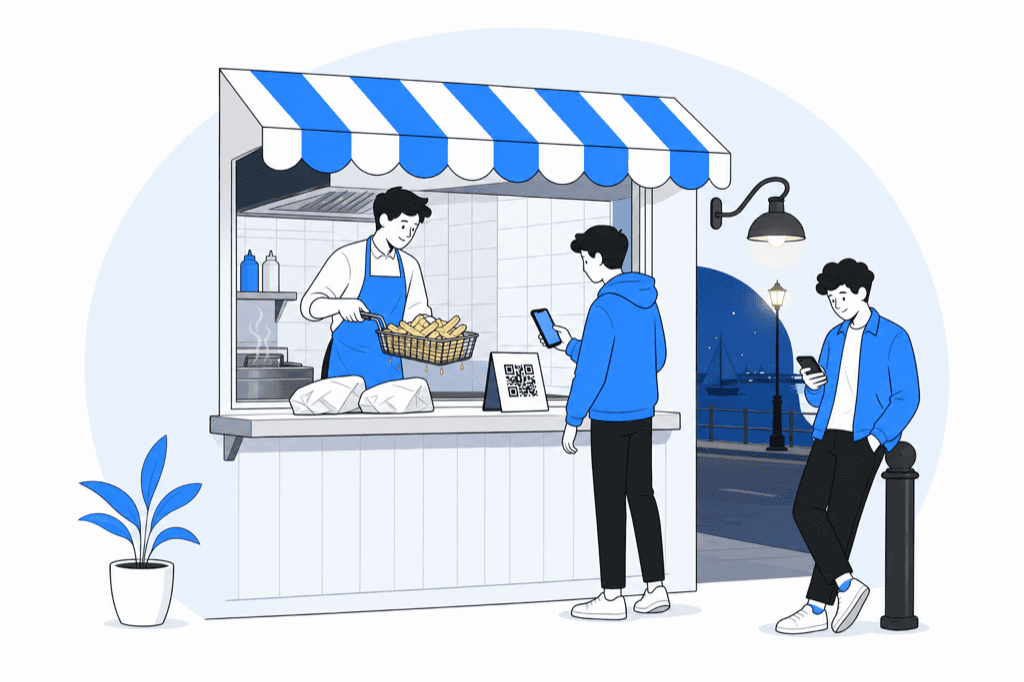 Customer scanning a QR code stand at a fish and chips shop window while the cook lifts a basket of chips